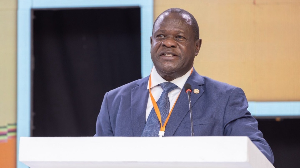 A speaker delivering remarks from the lectern at the 16th National Competitiveness Forum.